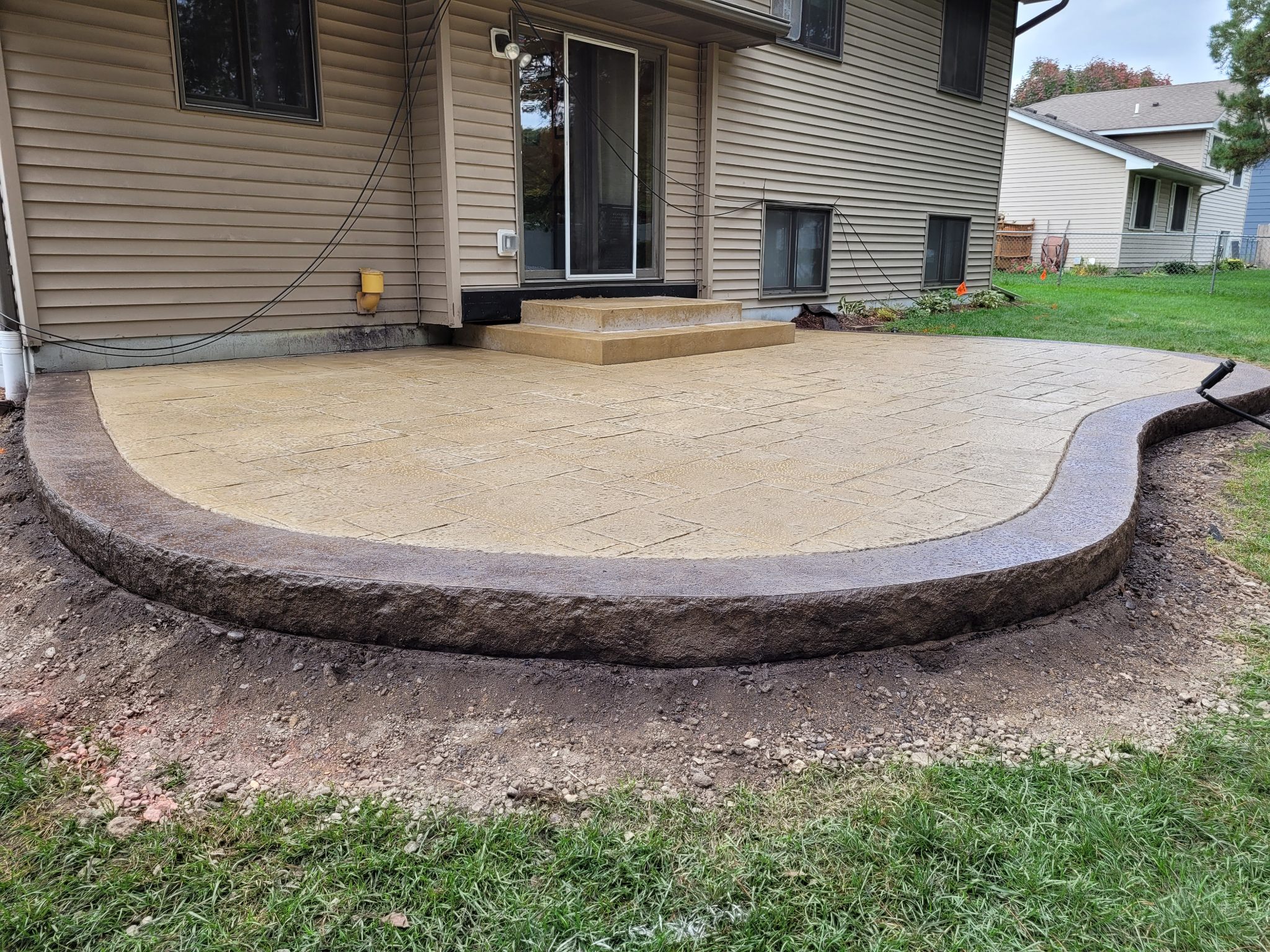 Stamped Concrete vs Pavers: Which Is Better for Your Patio or Driveway?