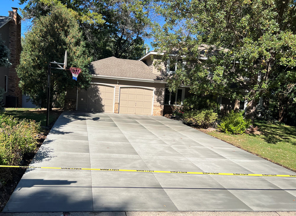 Poured concrete driveway installed in Andover MN by Creative Concrete Inc